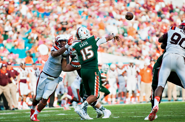 Miami Hurricanes QB #15, Brad Kaaya, throws a pass