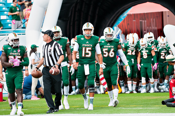 Miami Hurricanes QB #15, Brad Kaaya, leads the team captains out for the coin toss