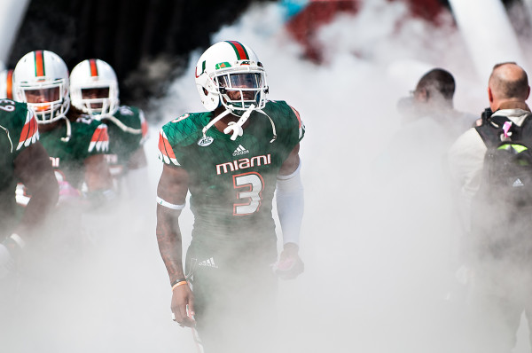 Miami Hurricanes WR #3, Stacy Coley, runs through the smoke