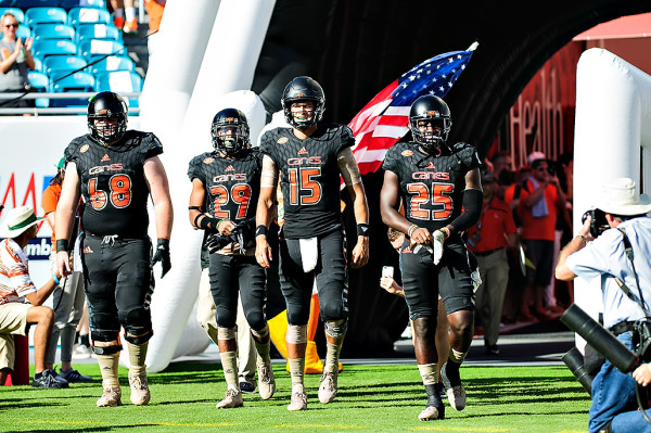 The Miami Hurricanes captains led by Brad Kaaya, walk out for the coin toss