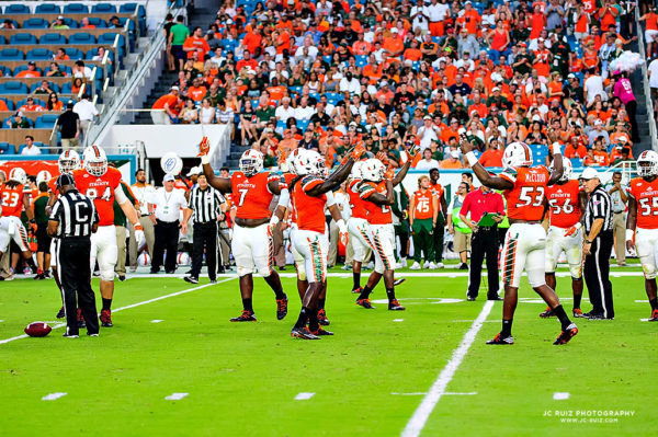 The Hurricanes defense tries to pump up the crowd at the start of the 2nd Quarter