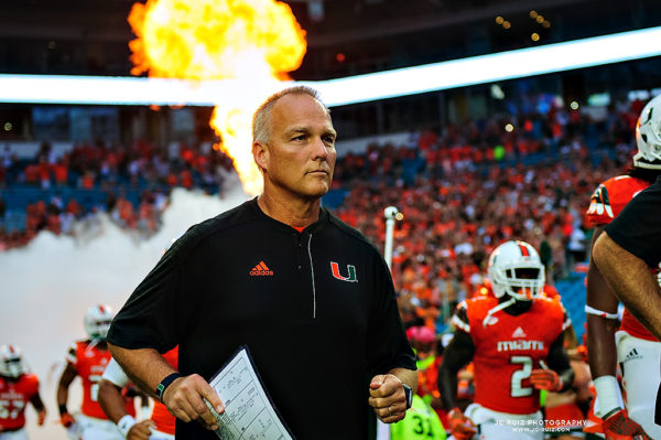 Mark Richt runs through the smoke