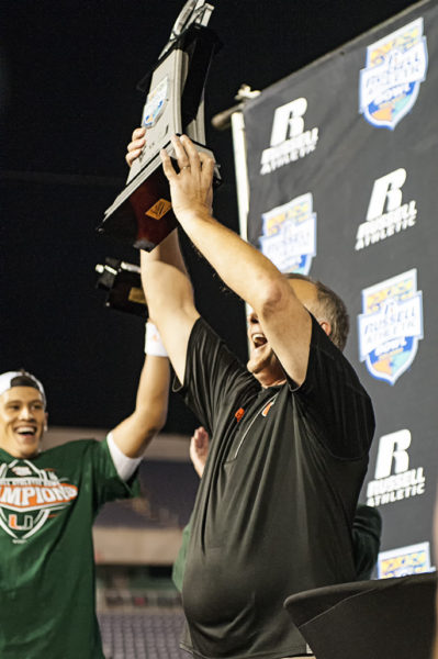 Mark Richt hoists up the championship trophy for all to see