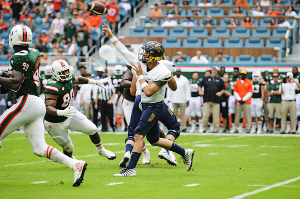 Logan Woodside launches a pass