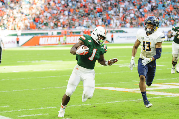 Mark Walton rushes with one shoe