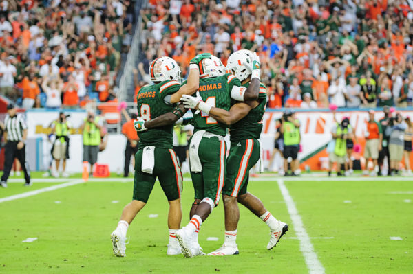 Jeff Thomas celebrates his touchdown with teammates