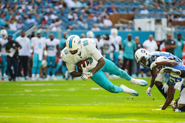 Dolphins TE, Julius Thomas, lunges for a first down