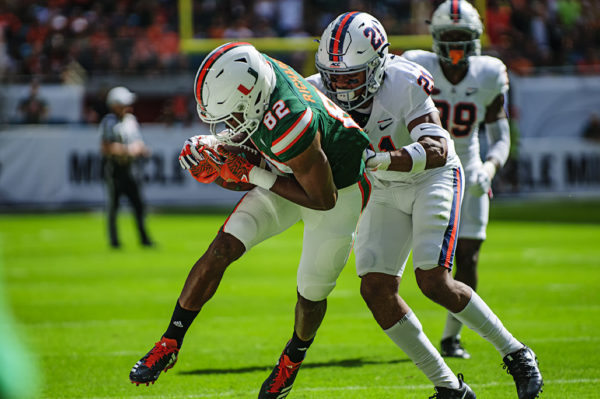 Ahmmon Richards (82) gets tackled by Juan Thornhill (21)