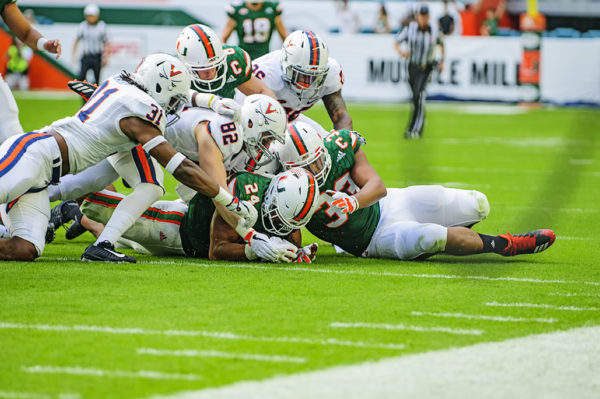 Travis Homer (24) recovers a fumble