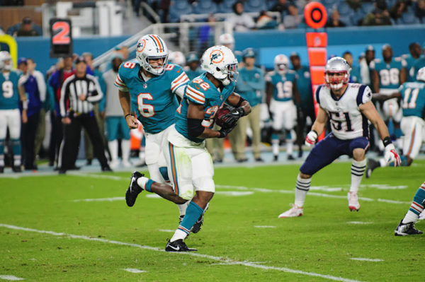 Jay Cutler hands off to Kenyan Drake