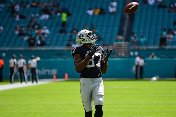 Oakland Raiders tight end Jared Cook (87) watches a pass come his way in warmups