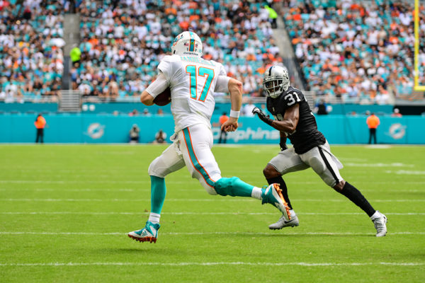 Miami Dolphins quarterback Ryan Tannehill (17) scrambles for a first down