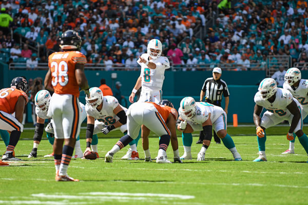 Miami Dolphins quarterback Brock Osweiler (8) points out a defender