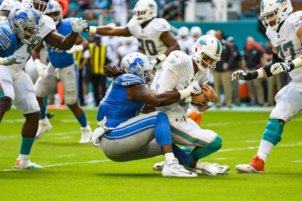 Detroit Lions defensive tackle Ricky Jean Francois (97) sacks Miami Dolphins quarterback Brock Osweiler (8)