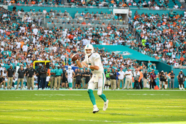 Miami Dolphins quarterback Brock Osweiler (8) looks for an open man in the endzone