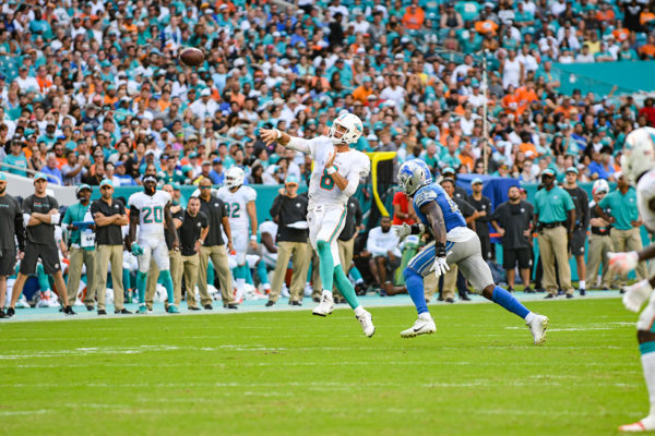 Miami Dolphins quarterback Brock Osweiler (8) throws a pass on the run