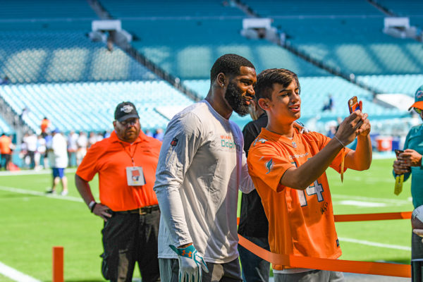 Miami Dolphins cornerback Xavien Howard (25) takes a selfie with a fan