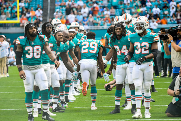 Miami Dolphins free safety Minkah Fitzpatrick (29) high fives teammates