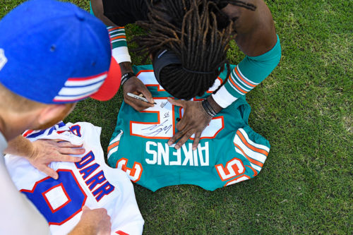 Miami Dolphins defensive back Walt Aikens (35) signs his jersey